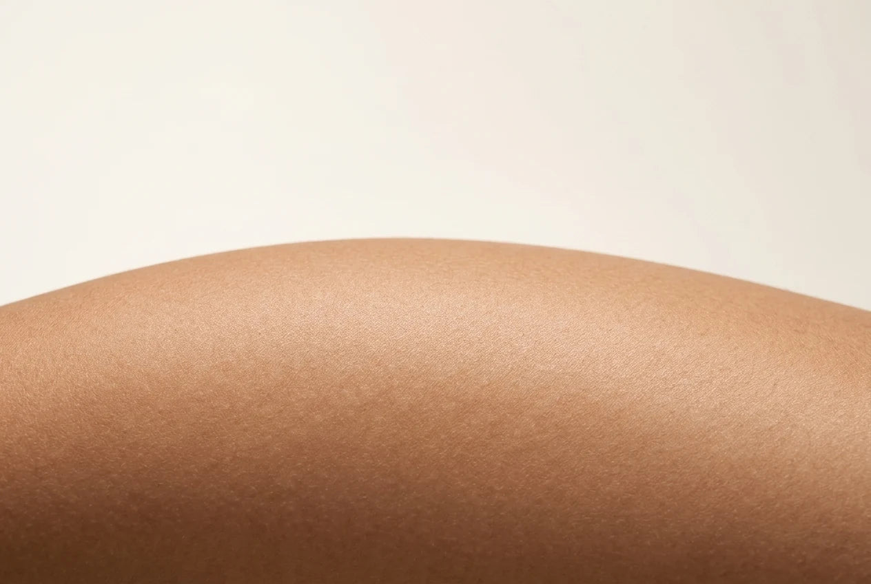 Close-up of clean, dry skin in soft studio light.